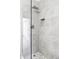 Modern tiled shower with glass door, rainfall showerhead, and built-in niche at 1908 Taft Dr, Lakewood, CO 80215