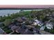 Aerial view of a residential area with a lake and greenery at 1655 Wolff St, Denver, CO 80204