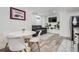 Finished basement with dining table, sofa, television and stylish decor at 1655 Wolff St, Denver, CO 80204
