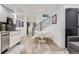 Finished basement with a kitchen, dining area, and staircase at 1655 Wolff St, Denver, CO 80204