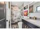 Contemporary bathroom with tiled shower, sleek vanity, and modern fixtures and decor at 1655 Wolff St, Denver, CO 80204