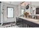 Modern bathroom featuring double vanity, sleek cabinetry, and a glass-enclosed shower at 1655 Wolff St, Denver, CO 80204
