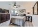 Cozy bedroom features stylish decor and large windows for natural light and a ceiling fan at 1655 Wolff St, Denver, CO 80204