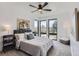 Bright bedroom with large windows and a comfortable bed setup at 1655 Wolff St, Denver, CO 80204