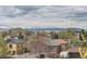 Urban cityscape view with snowy mountains in the distance, capturing a serene skyline at 1655 Wolff St, Denver, CO 80204
