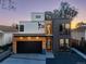 Contemporary home showcasing a striking facade with mixed materials and modern architectural design at 1655 Wolff St, Denver, CO 80204