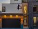 Modern home exterior with a garage, wooden accents, and address number 1655 at 1655 Wolff St, Denver, CO 80204