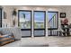 Living room featuring large windows with lake views, neutral decor, and ample natural light at 1655 Wolff St, Denver, CO 80204