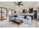 Open concept living space featuring modern sectional couch, with view to kitchen at 1655 Wolff St, Denver, CO 80204