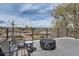 Outdoor deck with seating and a table to enjoy the neighborhood views at 1655 Wolff St, Denver, CO 80204