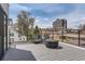 Enjoy outdoor deck seating and city views on this sleek deck space at 1655 Wolff St, Denver, CO 80204