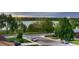 Scenic street view of a neighborhood near a lake with lush green trees and well-maintained sidewalks at 1655 Wolff St, Denver, CO 80204
