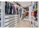 Spacious walk-in closet with custom shelving, drawers, and ample storage space at 1655 Wolff St, Denver, CO 80204