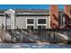 Townhouse backyard view with wooden fence and winter scene at 12520 E Cornell Cir, Aurora, CO 80014