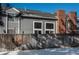 Townhouse backyard view with wooden fence and winter scene at 12520 E Cornell Cir, Aurora, CO 80014