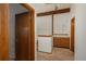 Upper hallway with wood cabinets and exposed beams at 12520 E Cornell Cir, Aurora, CO 80014