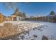 Large backyard with partially snow covered ground at 16046 E Harvard Ave, Aurora, CO 80013