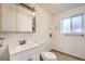 Clean and bright full bathroom with updated vanity at 16046 E Harvard Ave, Aurora, CO 80013