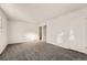 Simple bedroom with grey carpet and two closets at 16046 E Harvard Ave, Aurora, CO 80013