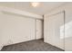 Charming basement bedroom with double doors and closet at 16046 E Harvard Ave, Aurora, CO 80013