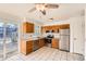 Bright kitchen features stainless steel appliances and granite countertops at 16046 E Harvard Ave, Aurora, CO 80013