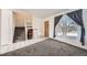 Open living room and foyer with view of staircase and large window at 16046 E Harvard Ave, Aurora, CO 80013