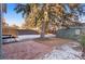 Large backyard with a brick patio and mature tree at 440 S York St, Denver, CO 80209