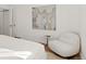 Spacious bedroom with a comfortable armchair and large artwork at 440 S York St, Denver, CO 80209