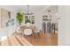 Elegant dining room with a wood table, white chairs, and a chandelier at 440 S York St, Denver, CO 80209