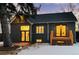 Charming dark-grey brick home with a deck and lights at 440 S York St, Denver, CO 80209