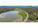 Beautiful aerial view of the community lake, surrounded by parks and lush trees at 8305 Eaton Way, Arvada, CO 80003