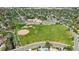 Aerial view featuring a school with baseball fields near a well-maintained residential area at 8305 Eaton Way, Arvada, CO 80003