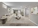 Finished basement living space with cozy carpet, neutral colors, and stylish decor at 8305 Eaton Way, Arvada, CO 80003