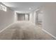 Expansive basement offering neutral carpet, recessed lights, and versatile living space at 8305 Eaton Way, Arvada, CO 80003