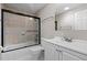 Bathroom featuring a white vanity with tile flooring and a shower and bathtub combo at 8305 Eaton Way, Arvada, CO 80003
