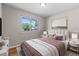 Inviting bedroom with large window and plush bedding at 8305 Eaton Way, Arvada, CO 80003