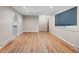 Open living room area with hardwood floors, natural light, and neutral paint at 8305 Eaton Way, Arvada, CO 80003