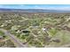 Panoramic aerial view of luxury homes spread across a rural landscape with pond at 1701 Creedmoor Ct, Castle Rock, CO 80109