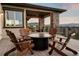 Relaxing deck with firepit and seating, offering scenic mountain views at 1701 Creedmoor Ct, Castle Rock, CO 80109