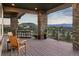 Relaxing deck with mountain views and seating area at 1701 Creedmoor Ct, Castle Rock, CO 80109