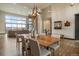 Elegant dining room features a large wooden table and stunning views at 1701 Creedmoor Ct, Castle Rock, CO 80109