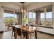 Elegant dining room with large windows and mountain views at 1701 Creedmoor Ct, Castle Rock, CO 80109