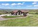 Charming home boasts a landscaped front yard, stone accents, and mountain views at 1701 Creedmoor Ct, Castle Rock, CO 80109