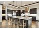 Modern kitchen with white countertops and dark cabinetry at 1701 Creedmoor Ct, Castle Rock, CO 80109