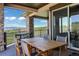 Spacious deck showcases beautiful stone work, outdoor dining and mountain views at 1701 Creedmoor Ct, Castle Rock, CO 80109