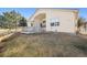 A cozy backyard featuring a small deck and well-maintained lawn, perfect for outdoor entertaining and relaxation at 24783 E Arkansas Pl, Aurora, CO 80018