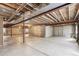 Unfinished basement with exposed ceiling and concrete flooring, ready for customization to fit your needs at 24783 E Arkansas Pl, Aurora, CO 80018