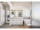 The bathroom features dual sinks, a soaking tub, and a glass enclosed shower, with ample storage at 24783 E Arkansas Pl, Aurora, CO 80018