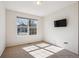 The bedroom features an empty room, neutral carpet and walls, and a window at 24783 E Arkansas Pl, Aurora, CO 80018