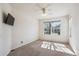 The bedroom features an empty room, neutral carpet and walls, and a window, with ceiling fan at 24783 E Arkansas Pl, Aurora, CO 80018